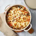 Once fully combined, transfer the mixture to the prepared baking dish, spreading it evenly Recipe