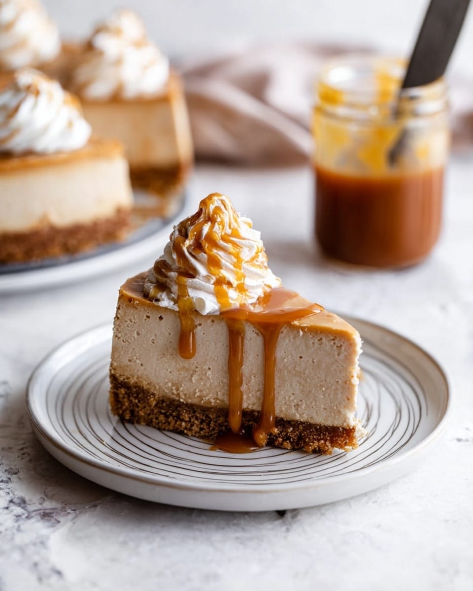 The image shows a round cheesecake on a white marble cake stand with a wooden base. The cheesecake has two layers: a light brown crumbly crust at the bottom and a thick, smooth beige creamy filling on top. Five swirls of pale cream whipped topping with caramel drizzle are placed evenly around the edge. A wedge-shaped slice is missing from the cheesecake, revealing the interior layers clearly. There are some crumbs scattered on the white marble surface beneath the stand, and a glass jar with caramel sauce is blurred in the background on the right. The setting is on a white marbled texture surface with a soft pink cloth partially visible on the left photo taken with an iphone --ar 4:5 --v 7