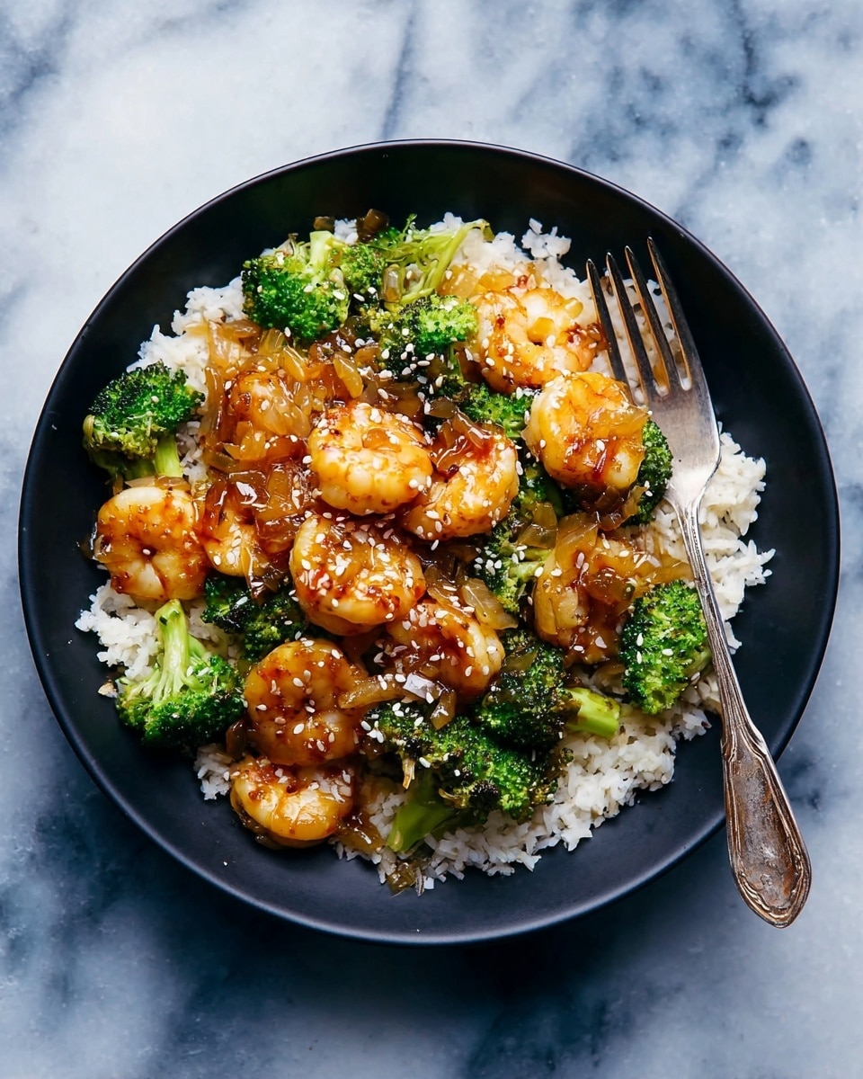 A white bowl filled with two layers: the bottom layer is bright green broccoli pieces with a fresh, slightly rough texture, and the top layer is a heap of shiny, reddish-orange cooked shrimp with a caramelized glaze. The shrimp are sprinkled with small white sesame seeds and chopped green onions, adding pops of contrasting color. The shrimp look juicy and well-cooked, sitting densely over the broccoli. Photo taken with an iphone --ar 4:5 --v 7