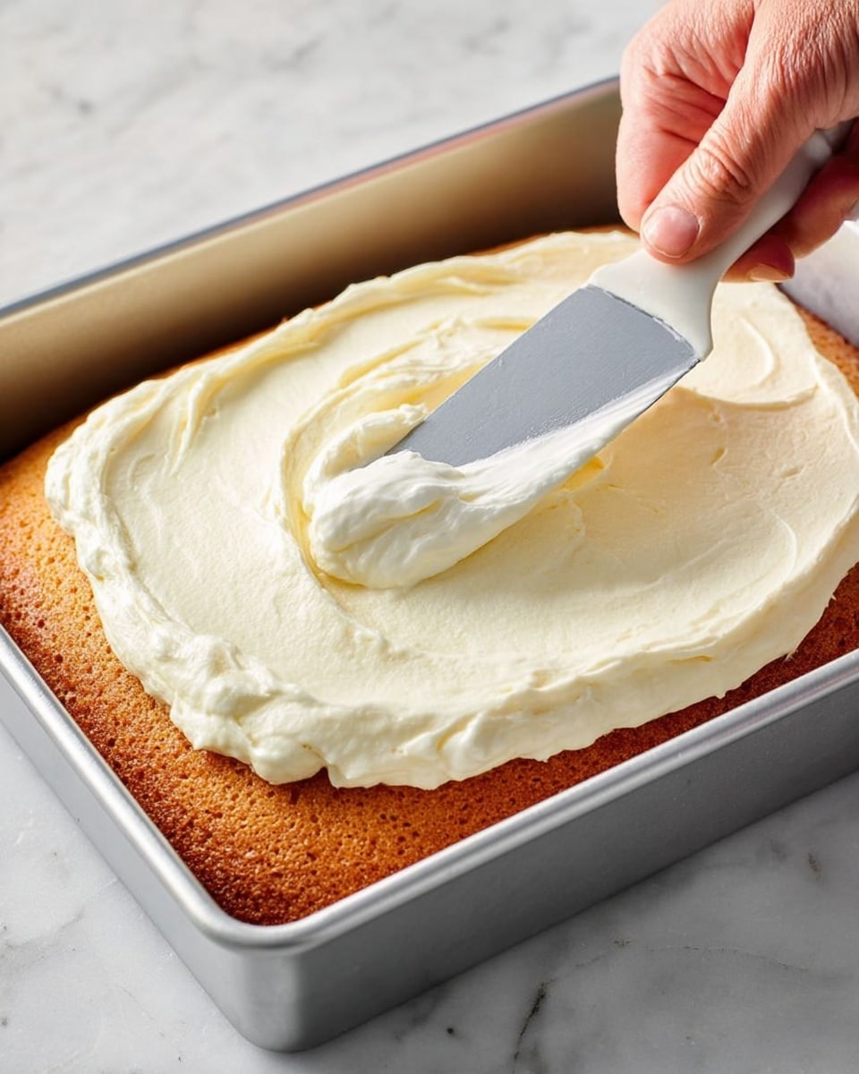 The image shows several pieces of a brown cake with a thick white frosting layer on top, cut into rectangular shapes. There are three plates: a white speckled plate with two cake pieces and a fork holding a small cake piece, another white speckled plate with two cake pieces in the background, and a larger white speckled plate with more cake pieces and crumbs on the right. A glass of milk and a small white bowl filled with white sugar cubes sit on a white marbled surface, along with a clear glass cup of dark coffee. The texture of the cake looks moist and soft, and the frosting is smooth but has visible swirls. photo taken with an iphone --ar 4:5 --v 7