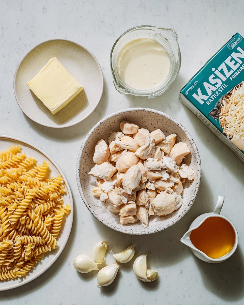 The image shows a close-up of a white ceramic baking dish filled with a baked creamy pasta casserole. The top layer is golden-brown with melted cheese, creating a slightly crispy texture. Visible throughout the cheese are browned pieces of chicken, topped with finely chopped green herbs scattered evenly across the surface. Below the cheese and chicken, a creamy sauce surrounds the tubular pasta, which appears soft and coated in white sauce. The baking dish rests on a white marbled surface, highlighting the warm, rich colors of the food. Photo taken with an iphone --ar 4:5 --v 7