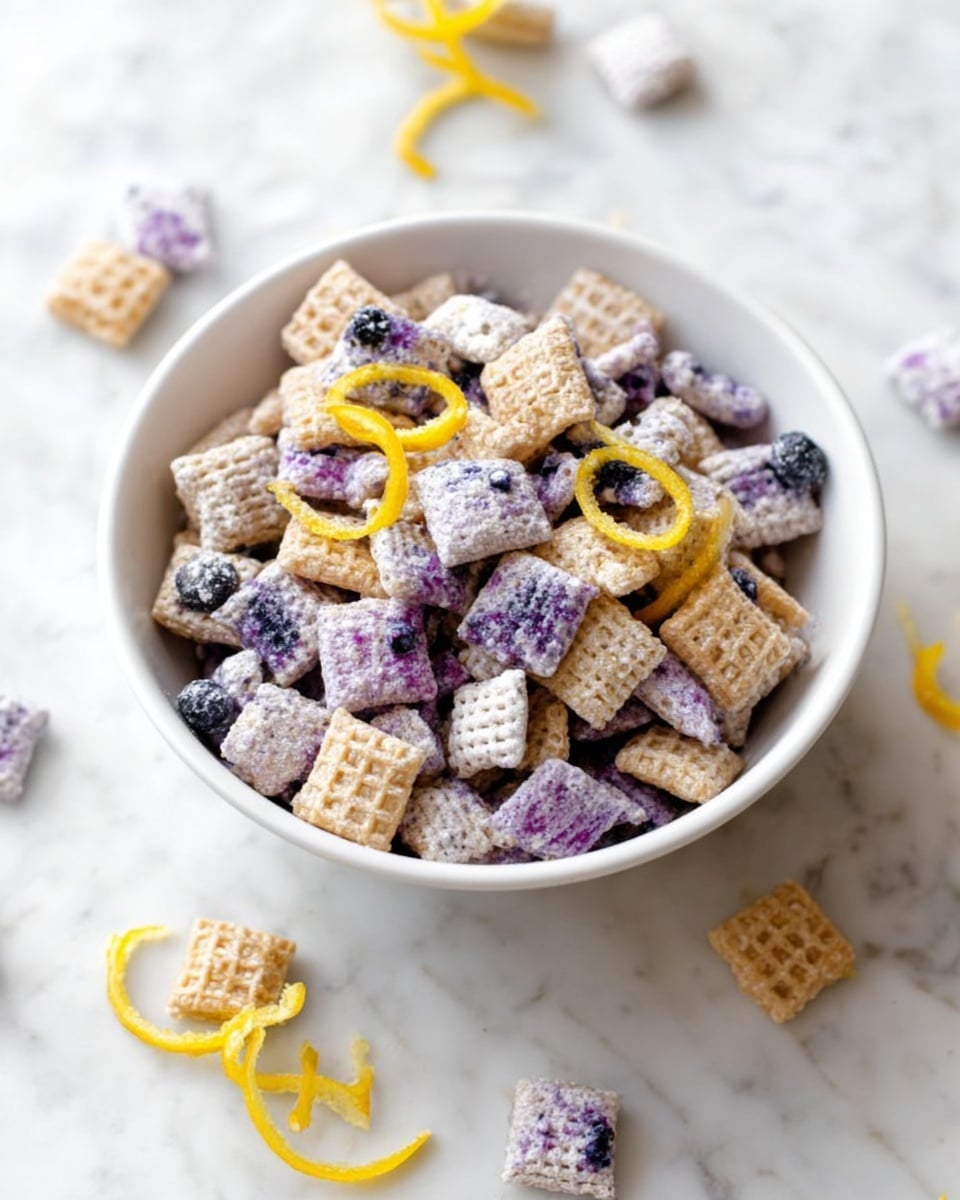 A white bowl filled with square cereal pieces that have a waffle-like texture and are covered in powdered sugar, some pieces are mixed with a purple coating, likely blueberry flavor, giving a mix of light beige and purple tones. Thin yellow lemon zest strips are sprinkled on top, adding a bright contrast. A few cereal pieces are scattered around the bowl on a white marbled surface, with a gold chain decoration partially visible on the edges. The scene is bright with natural light, showing a clean and fresh look, photo taken with an iphone --ar 4:5 --v 7