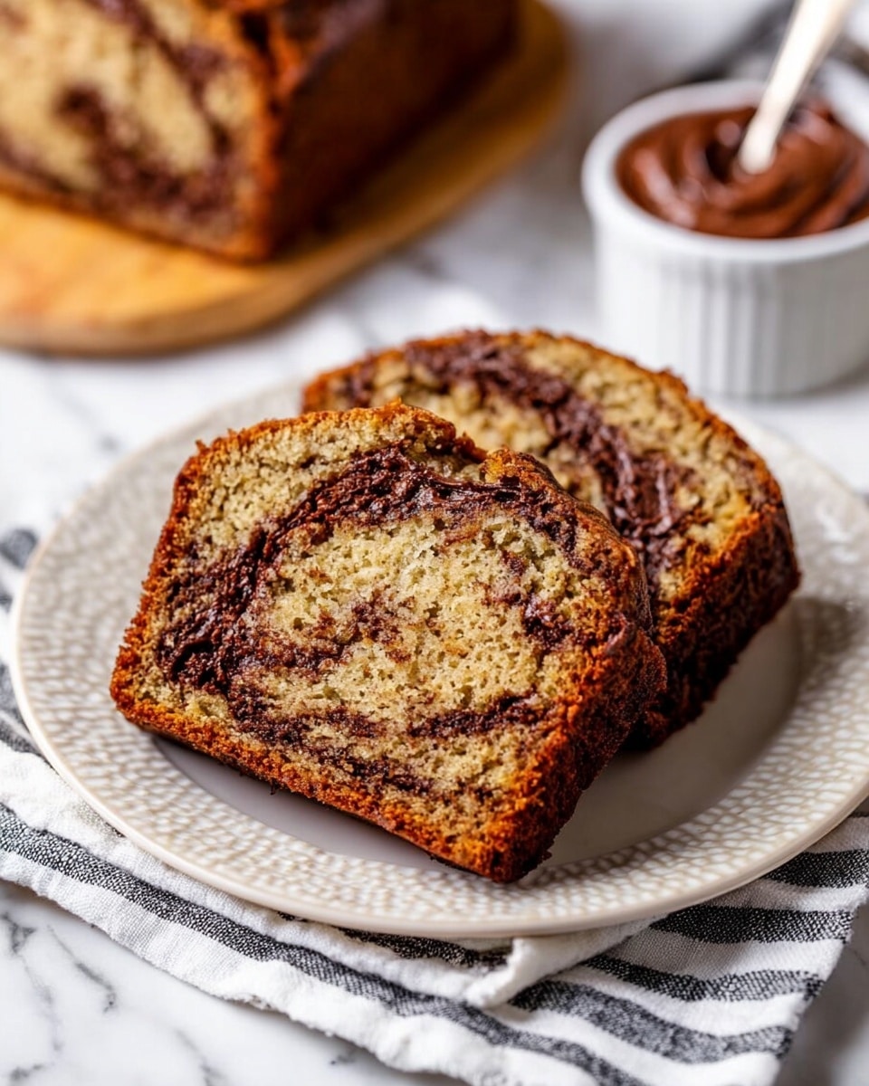 A rectangular loaf of marbled chocolate and vanilla bread with a textured, cracked top showing swirls of dark chocolate and lighter brown batter, still in a metal baking pan lined with a slightly stained parchment paper on two sides. The pan rests on a soft white and black striped cloth, which is spread out on a white marbled tabletop. Nearby, a wooden cutting board is placed beneath the pan, and a wooden spatula with cursive writing is tucked under the cloth. A golden spoon with smeared chocolate sits on the cutting board, a small white bowl with a spoonful of salt or sugar is on the side, and a bottle with a label stands next to the bowl. A serrated knife with a purple handle lies flat on the marble surface behind the pan. Photo taken with an iphone --ar 4:5 --v 7