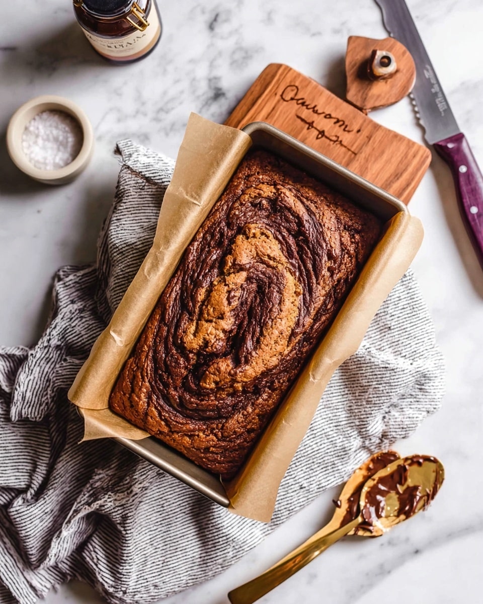 Two thick slices of banana bread lie flat on a white plate with a textured rim. Each slice shows a golden-brown crust with a moist, soft interior that has visible dark chocolate swirls running through the light brown bread layers. The plate is set on a white cloth with black stripes, which rests on a white marbled surface. In the background, there is a wooden board with more banana bread and a white ramekin filled with smooth chocolate spread, next to a silver spoon holding some of the spread. Photo taken with an iphone --ar 4:5 --v 7